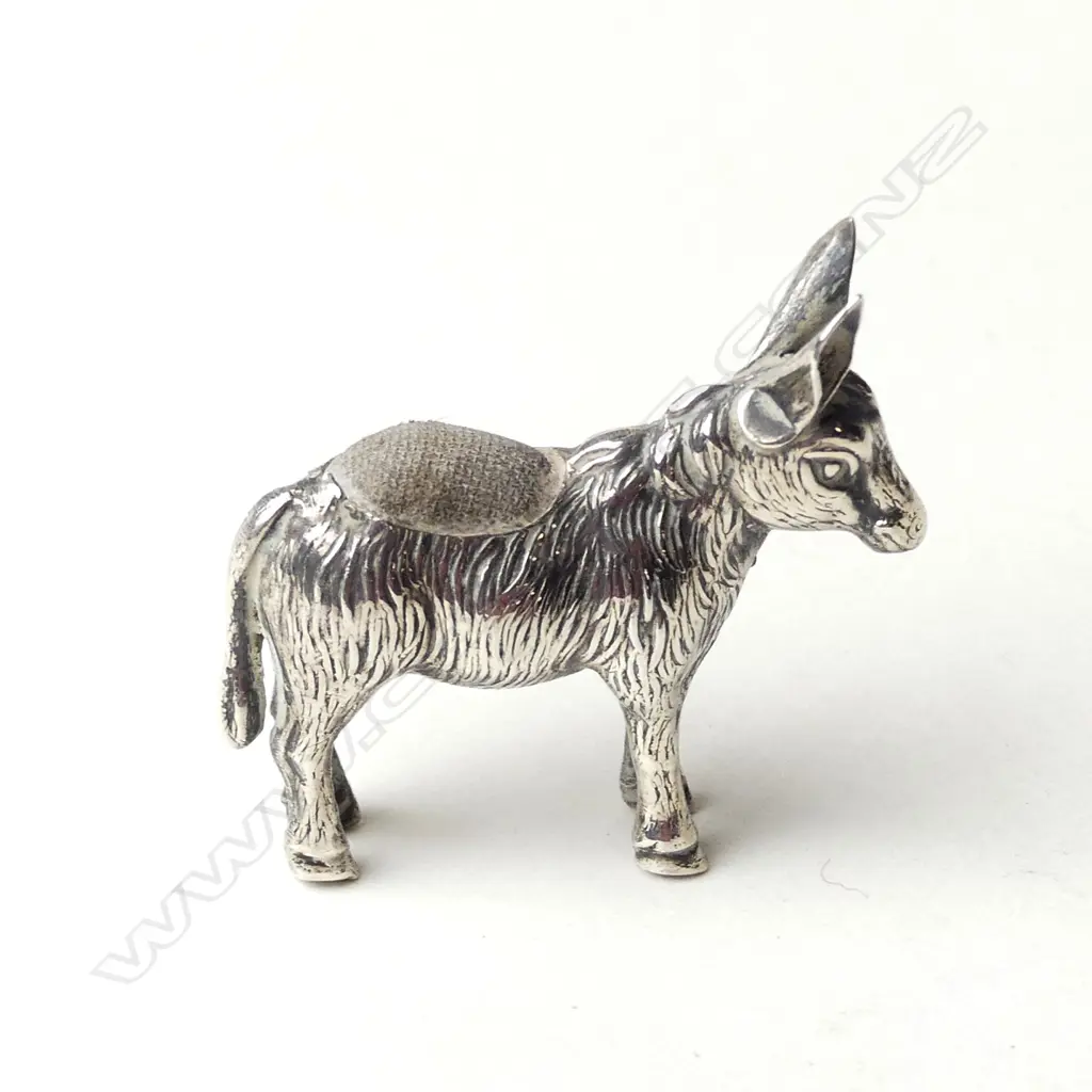 A small novelty Edwardian silver donkey pin cushion Image 1++