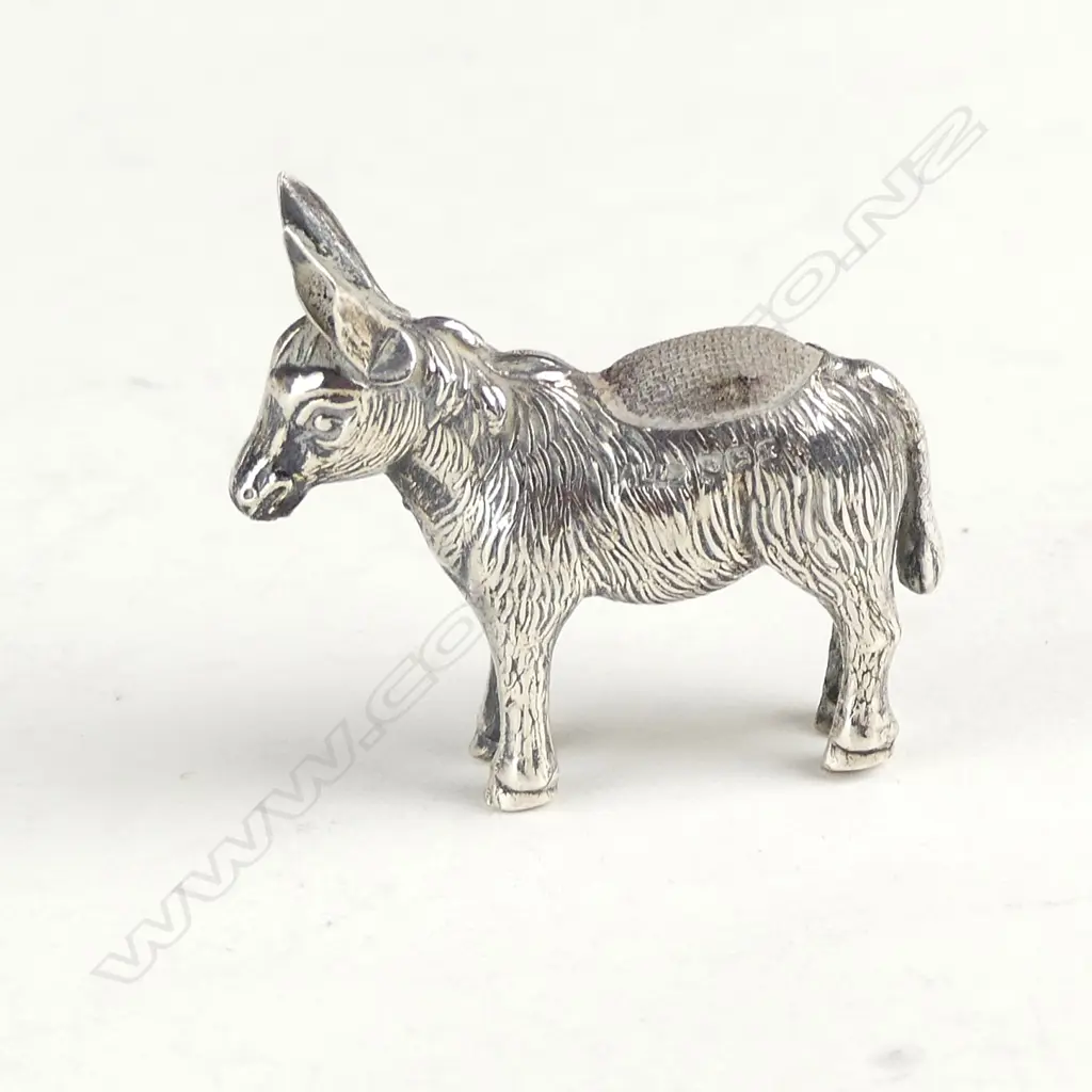 A small novelty Edwardian silver donkey pin cushion Image 1++