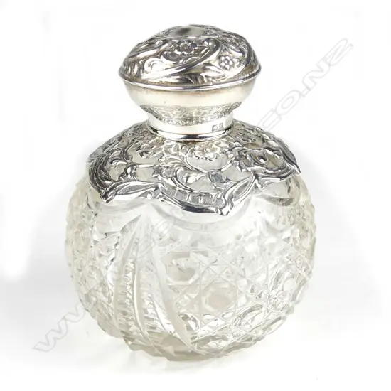 An Edwardian silver topped cut crystal scent bottle
