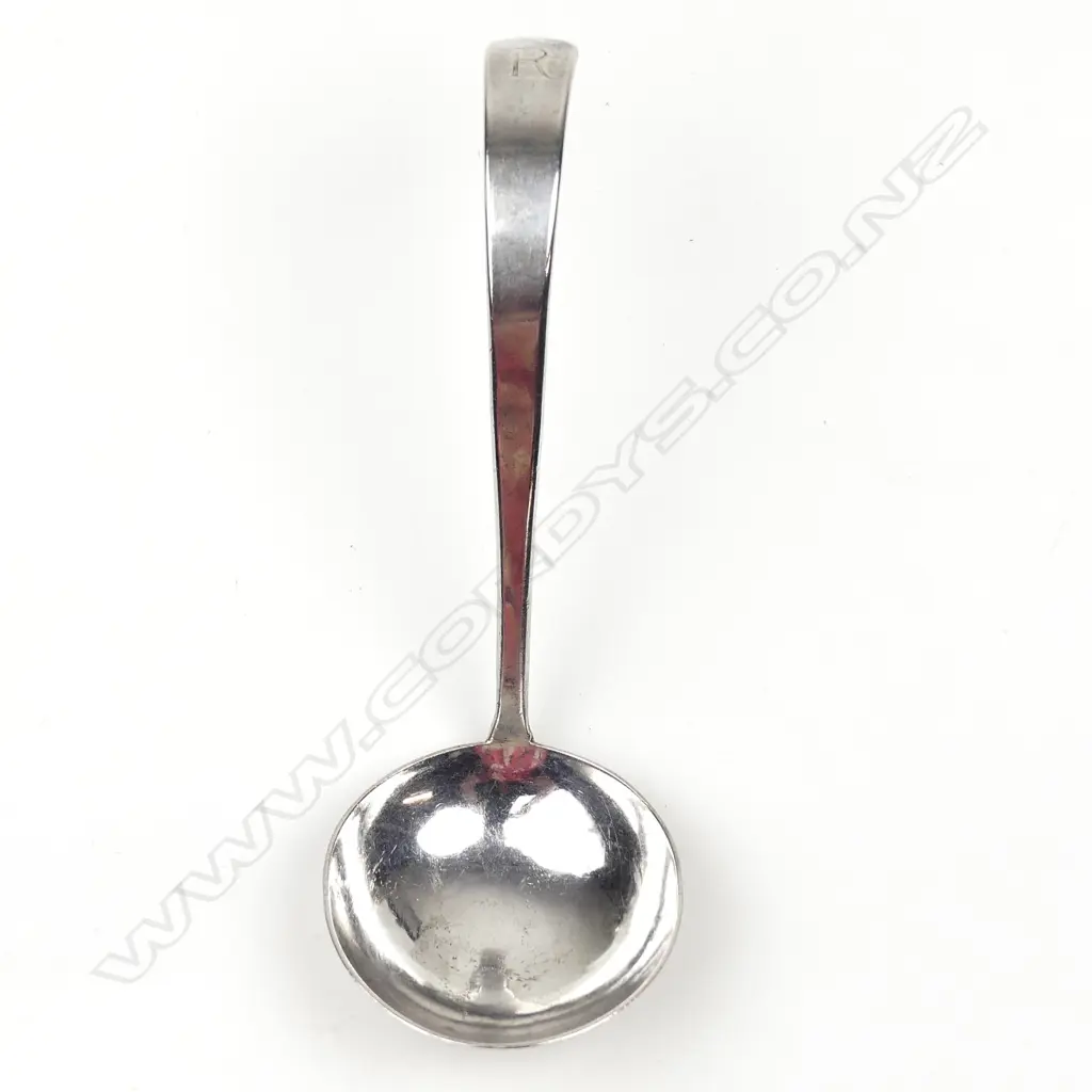 A silver sauce ladle Image 1++
