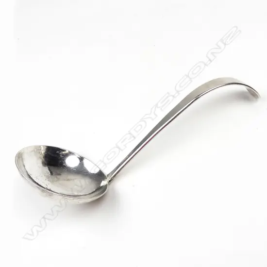 A silver sauce ladle