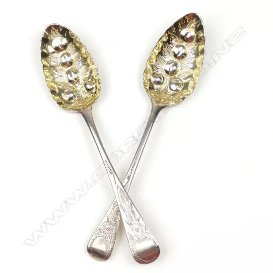 A pair of silver berry spoons