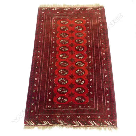A hand knotted Bokhara rug