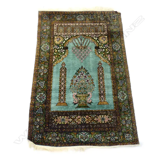 A hand knotted Kashmir silk prayer rug