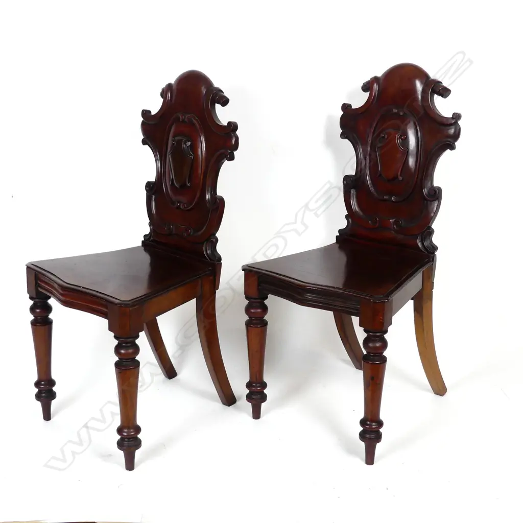 A pair of Victorian mahogany hall chairs Image 1++