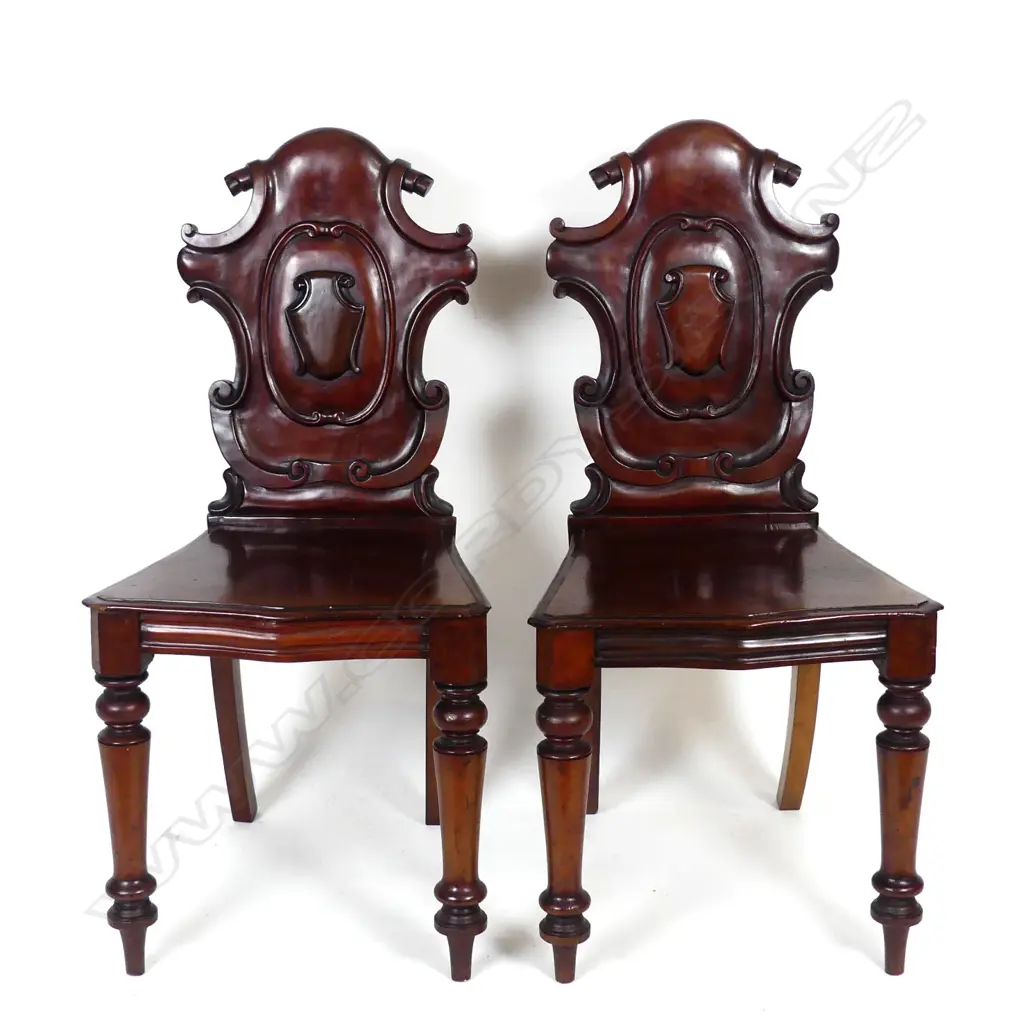 A pair of Victorian mahogany hall chairs Image 1++