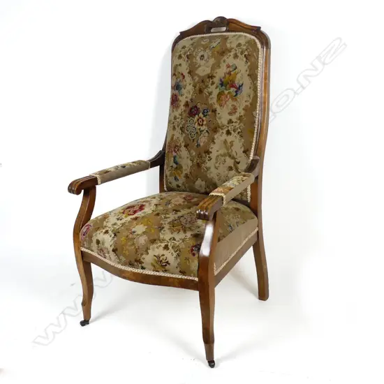 A Victorian mahogany high-back open elbow armchair