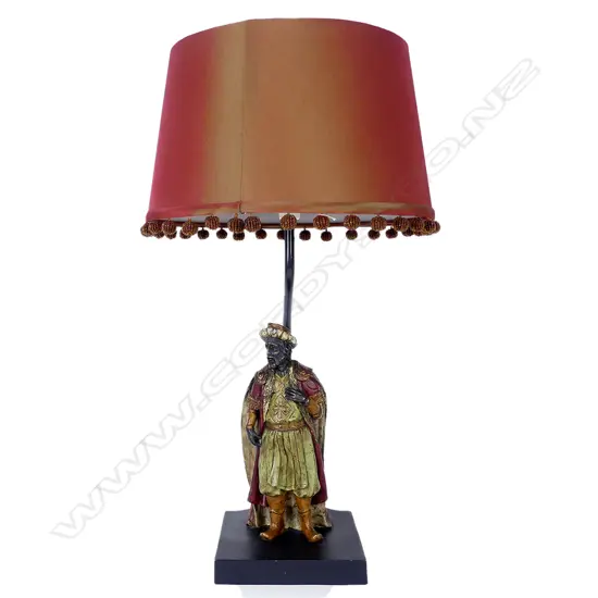 A bronze blackamoor based table lamp