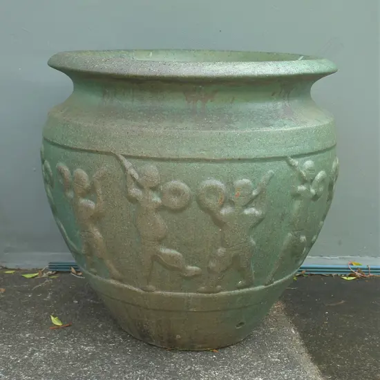 A large and impressive green salt glazed garden pot