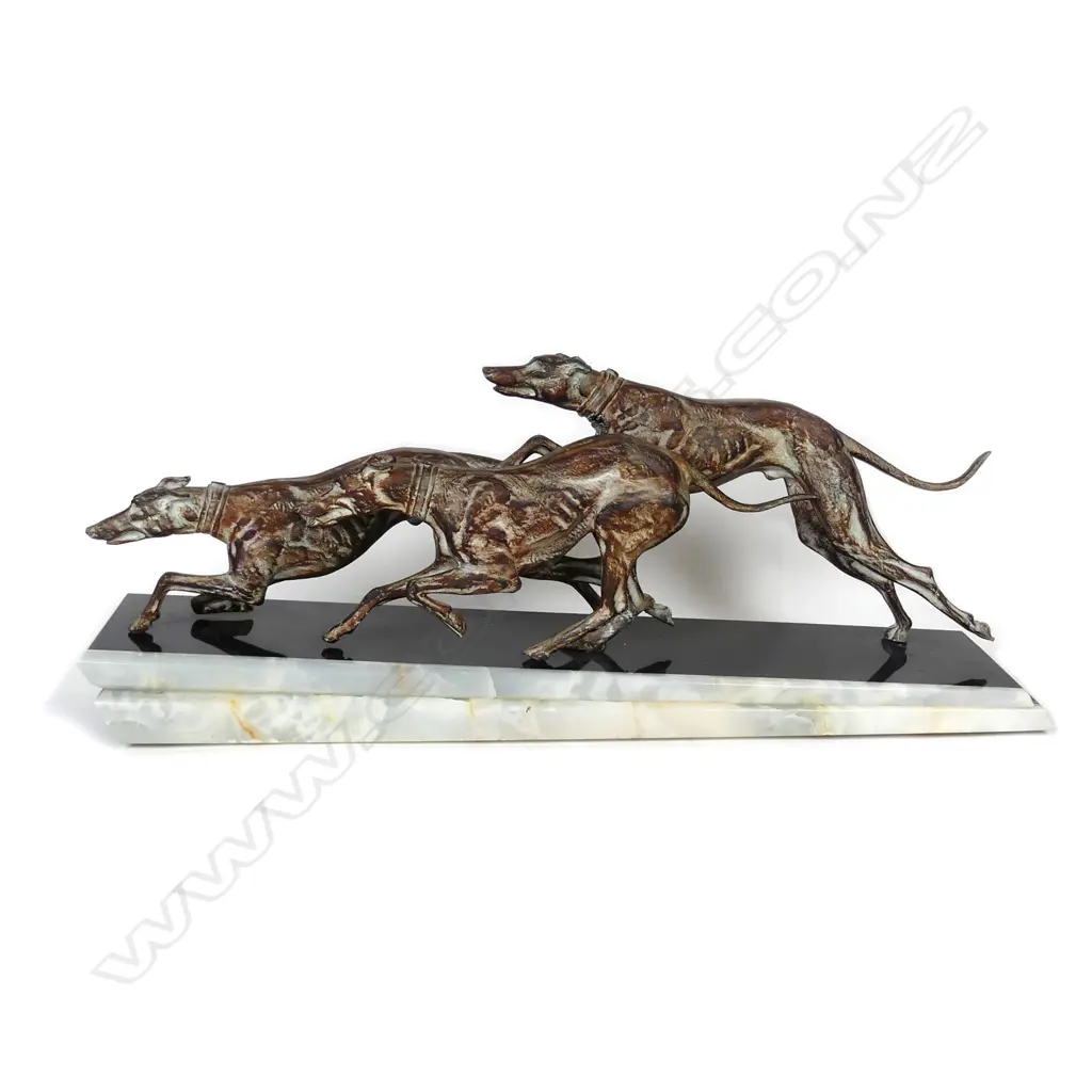 An Art Deco animalia group of three racing hounds Image 1++