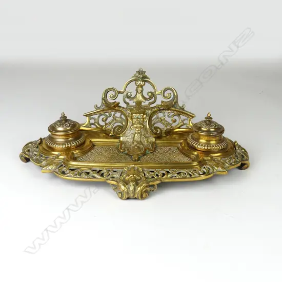 A Victorian brass standish