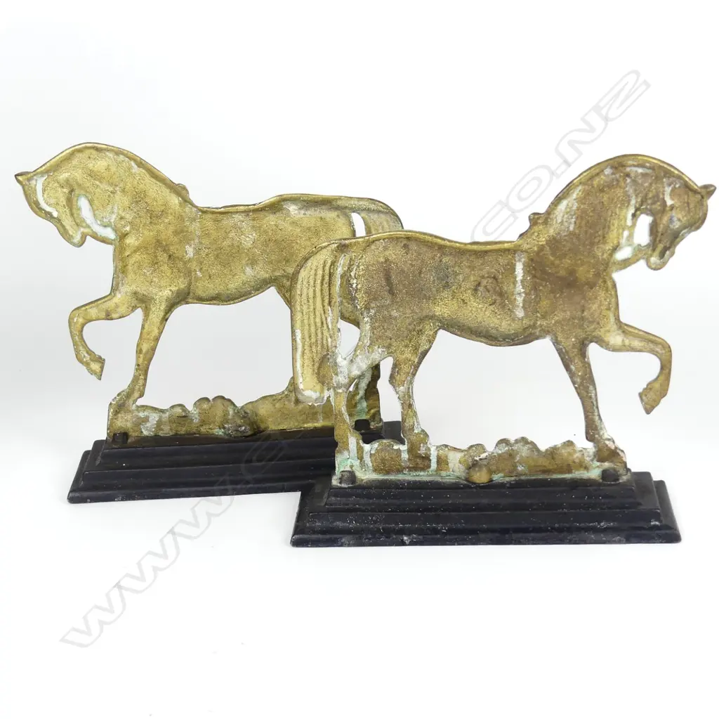 A pair of old brass horse door stops Image 1++