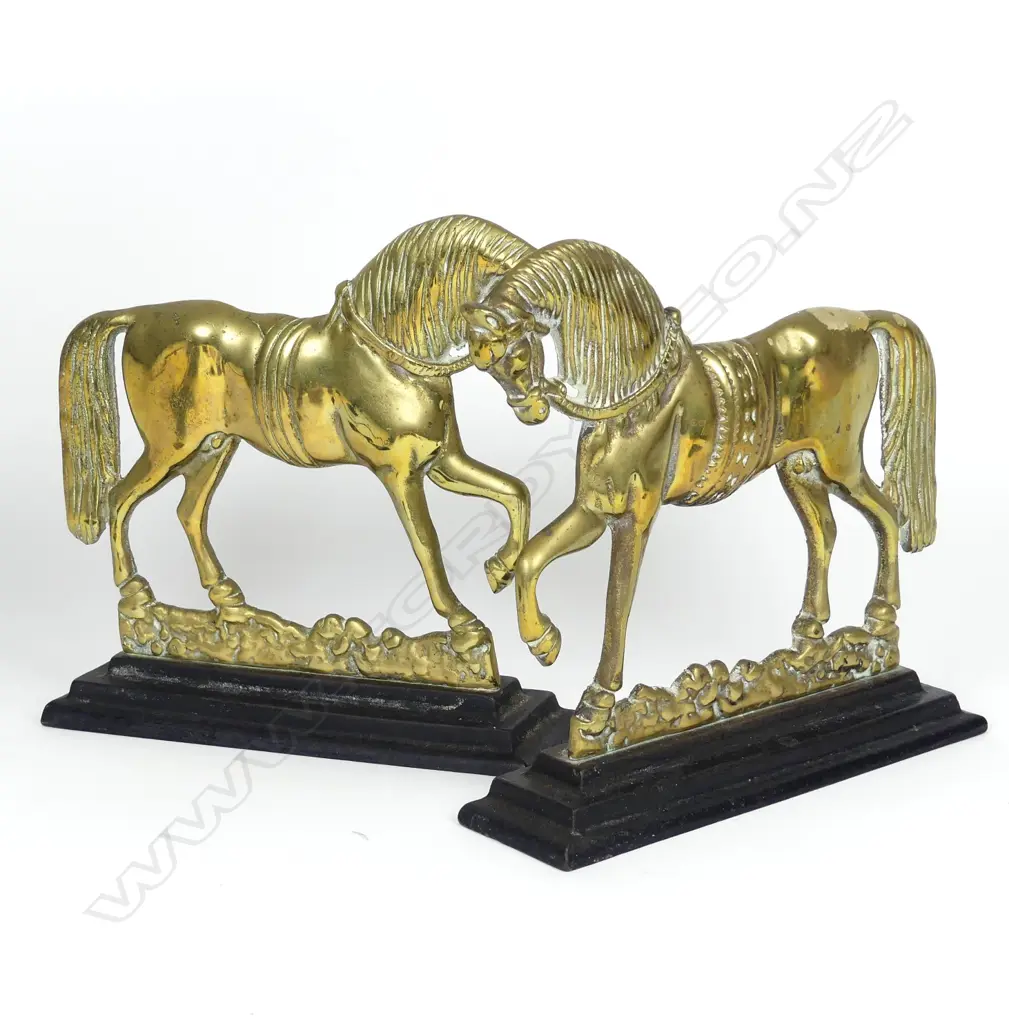A pair of old brass horse door stops Image 1++