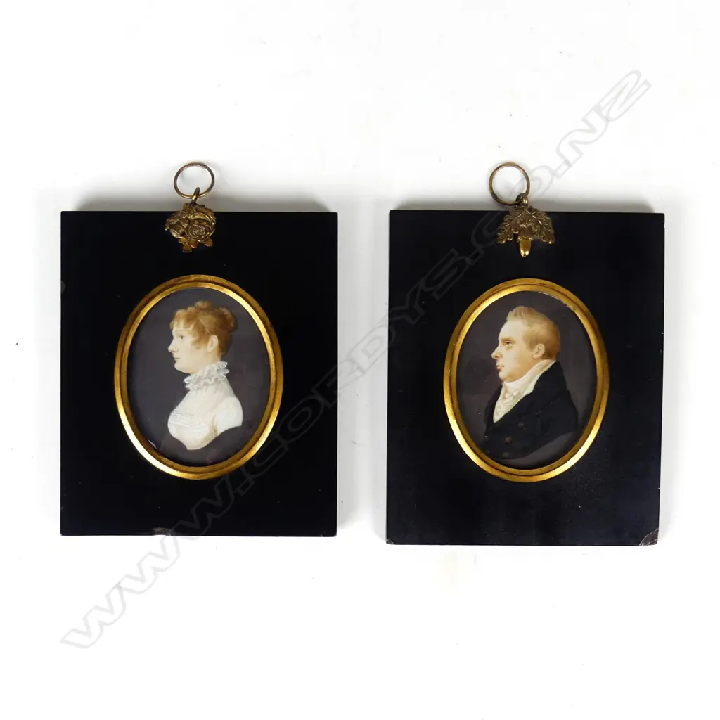 A pair of George III hand painted portrait miniatures Image 1++