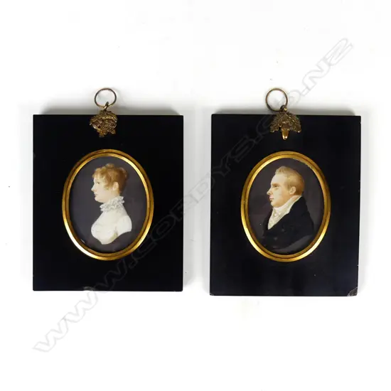 A pair of George III hand painted portrait miniatures