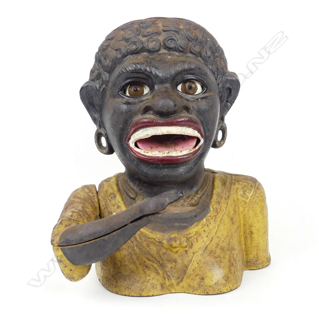 A vintage Dinah cast iron money bank Image 1++