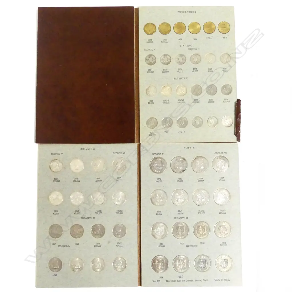 Two Dansco numismatic folders of 92 Fijian pre-decimal coins Image 1++