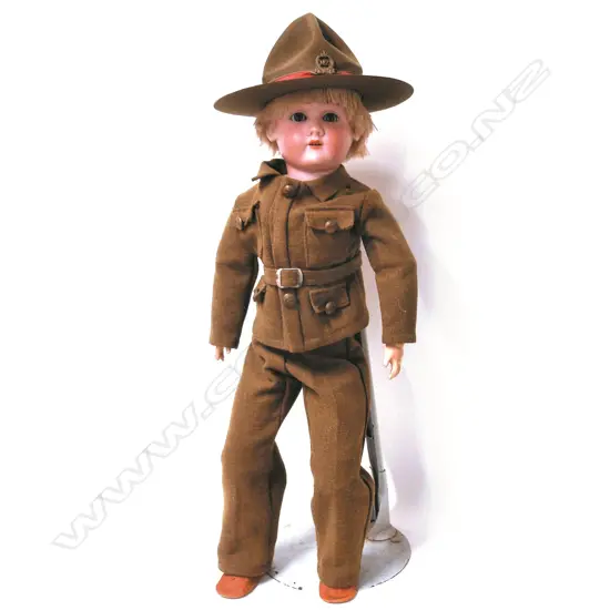 An N.Z. military dressed porcelain head doll