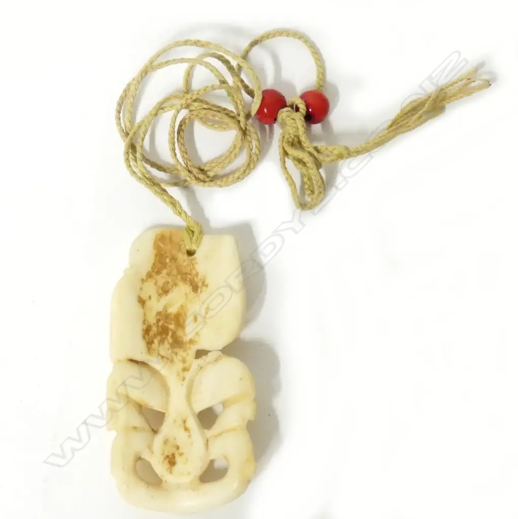 A vintage bone tiki Image 1++