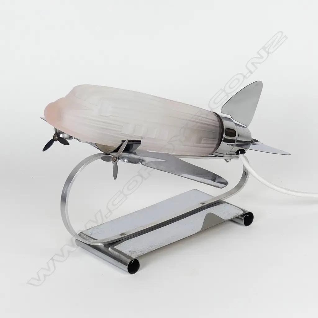 A reproduction Art Deco chrome and pink glass aeroplane desk lamp Image 1++