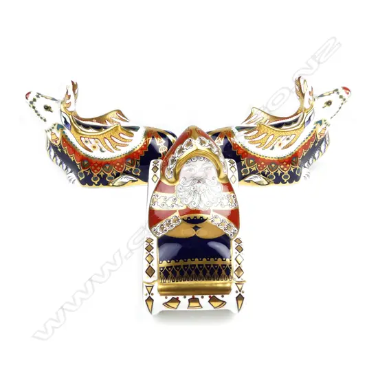 A set of three Royal Crown Derby paperweights