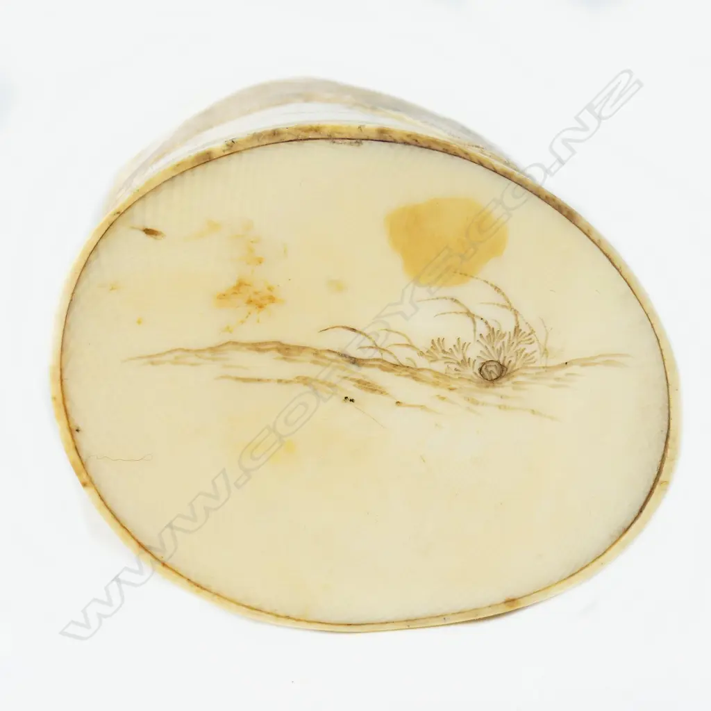 A carved ivory tusk section canister Image 1++