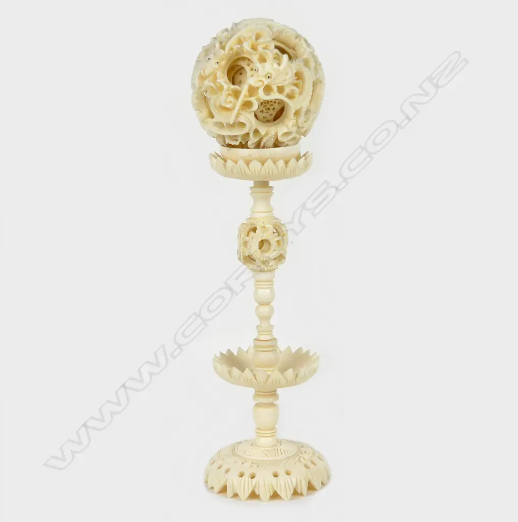 A good early/mid-20thC Chinese finely carved ivory puzzle ball on stand Image 1++
