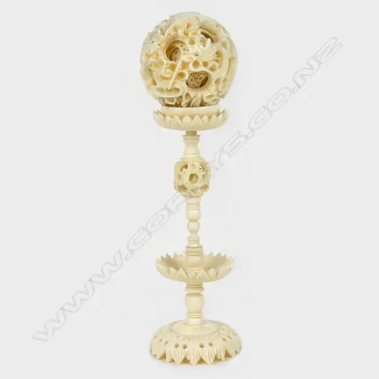 A good early/mid-20thC Chinese finely carved ivory puzzle ball on stand