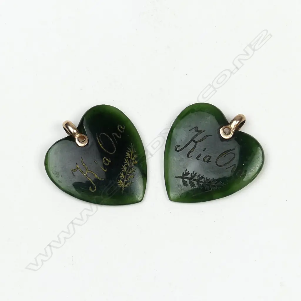 A pair of pounamu (greenstone) heart pendants Image 1++