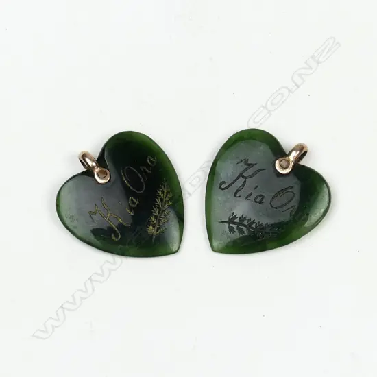 A pair of pounamu (greenstone) heart pendants