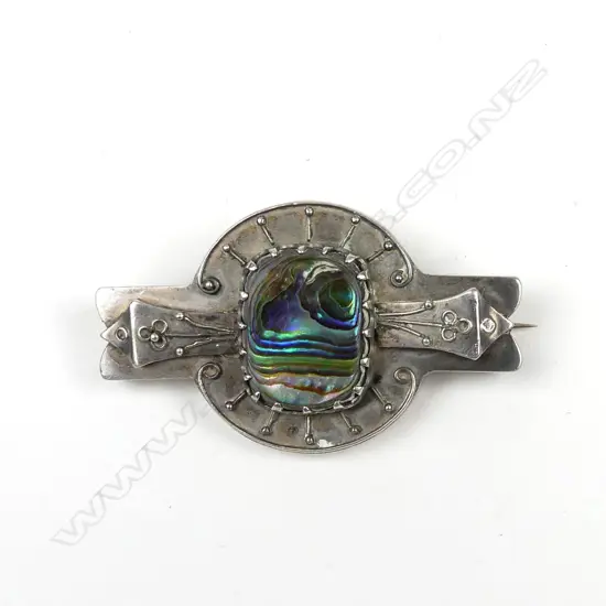 An early 20thC N.Z. hand crafted silver and paua brooch