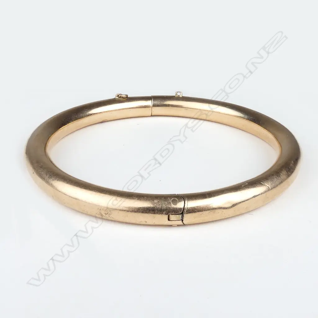 A 1920's rose gold hinged bangle Image 1++