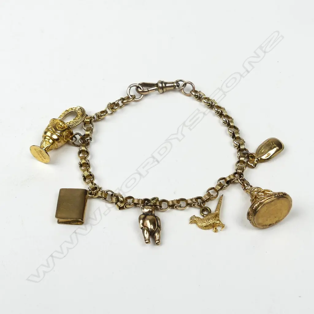 A vintage 9ct. yellow gold charm bracelet Image 1++