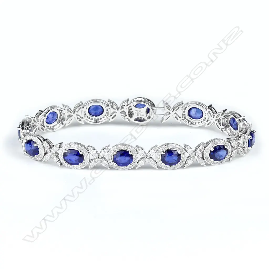 A 14ct white gold diamond and sapphire bracelet Image 1++