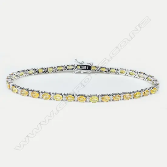 A 14ct white gold diamond and sapphire tennis bracelet