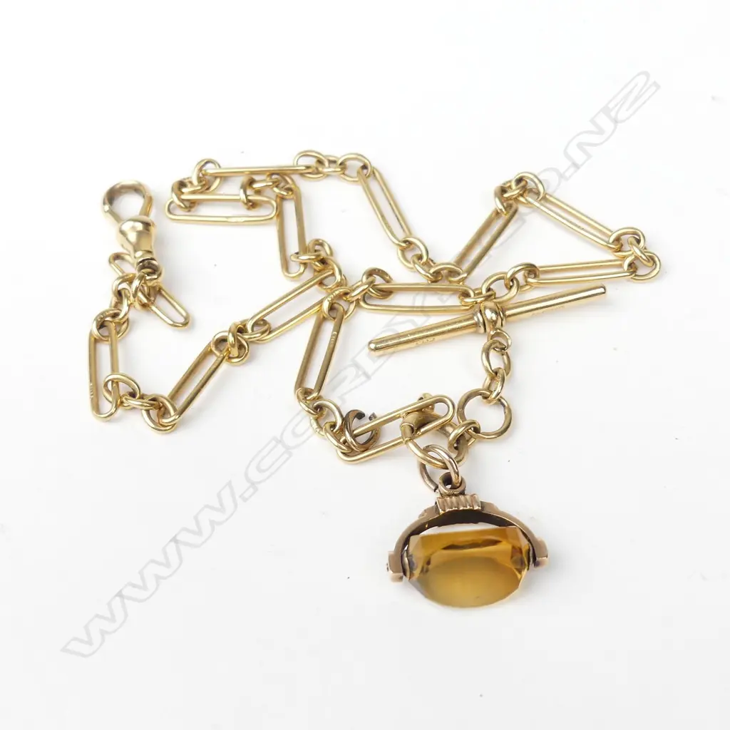 An 18ct gold watch chain and spinner Image 1++