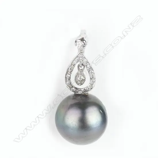 An 18ct white pearl and diamond pendant