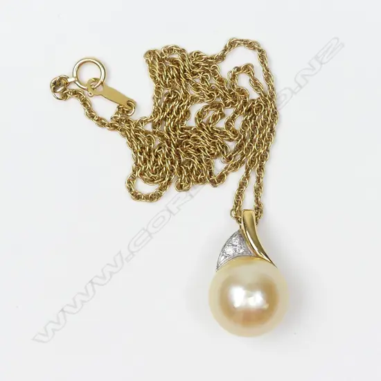 An 18ct gold pearl and diamond pendant