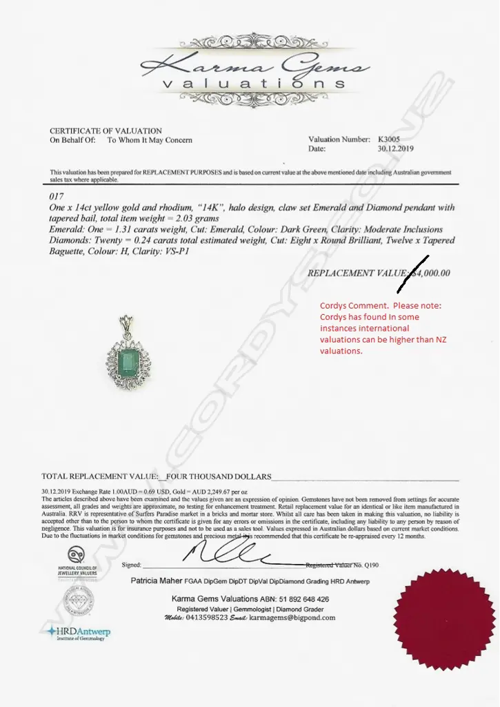 A 14ct gold emerald and diamond pendant Image 1++