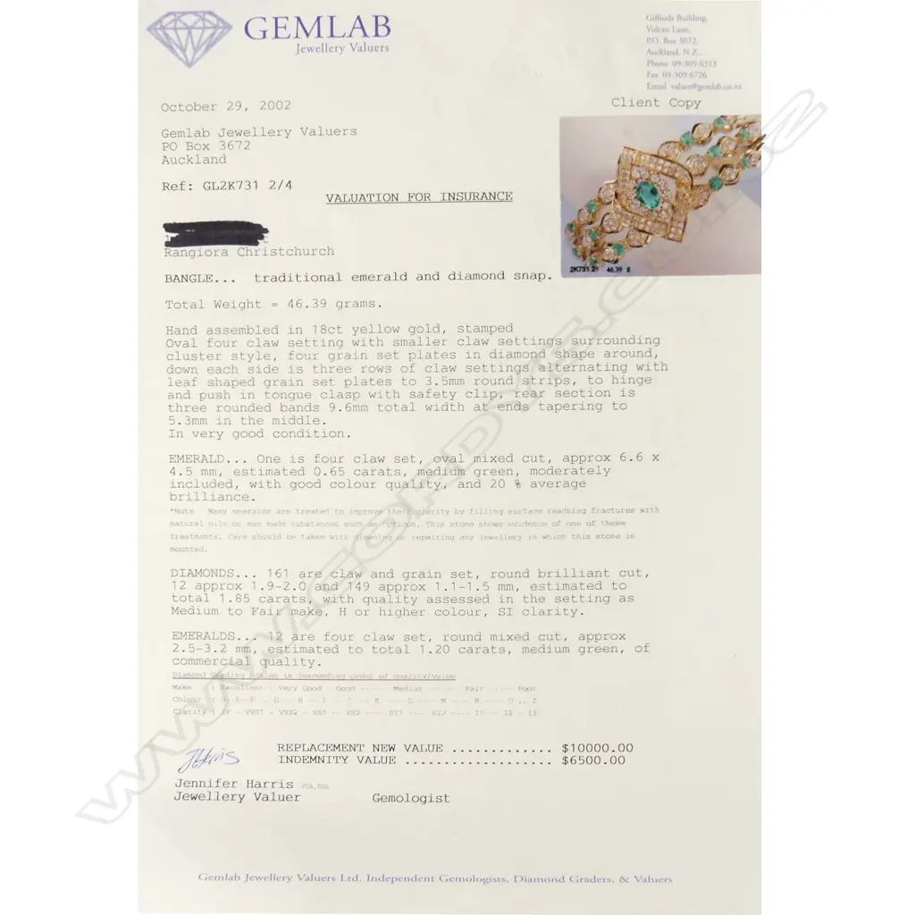 An 18ct gold emerald and diamond hinged bangle Image 1++