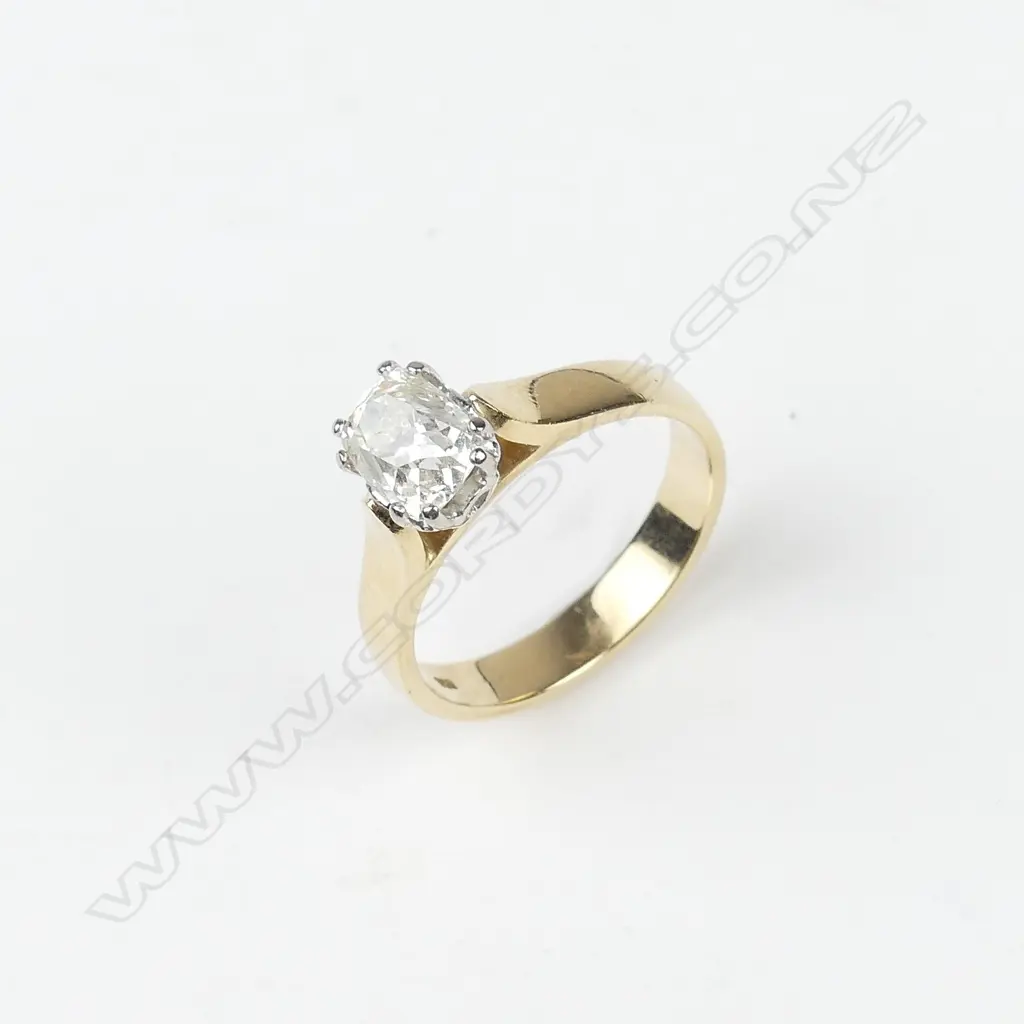 An 18ct gold and 1.50ct diamond solitaire ring Image 1++