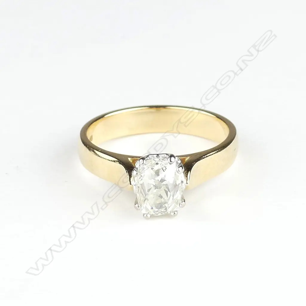 An 18ct gold and 1.50ct diamond solitaire ring Image 1++