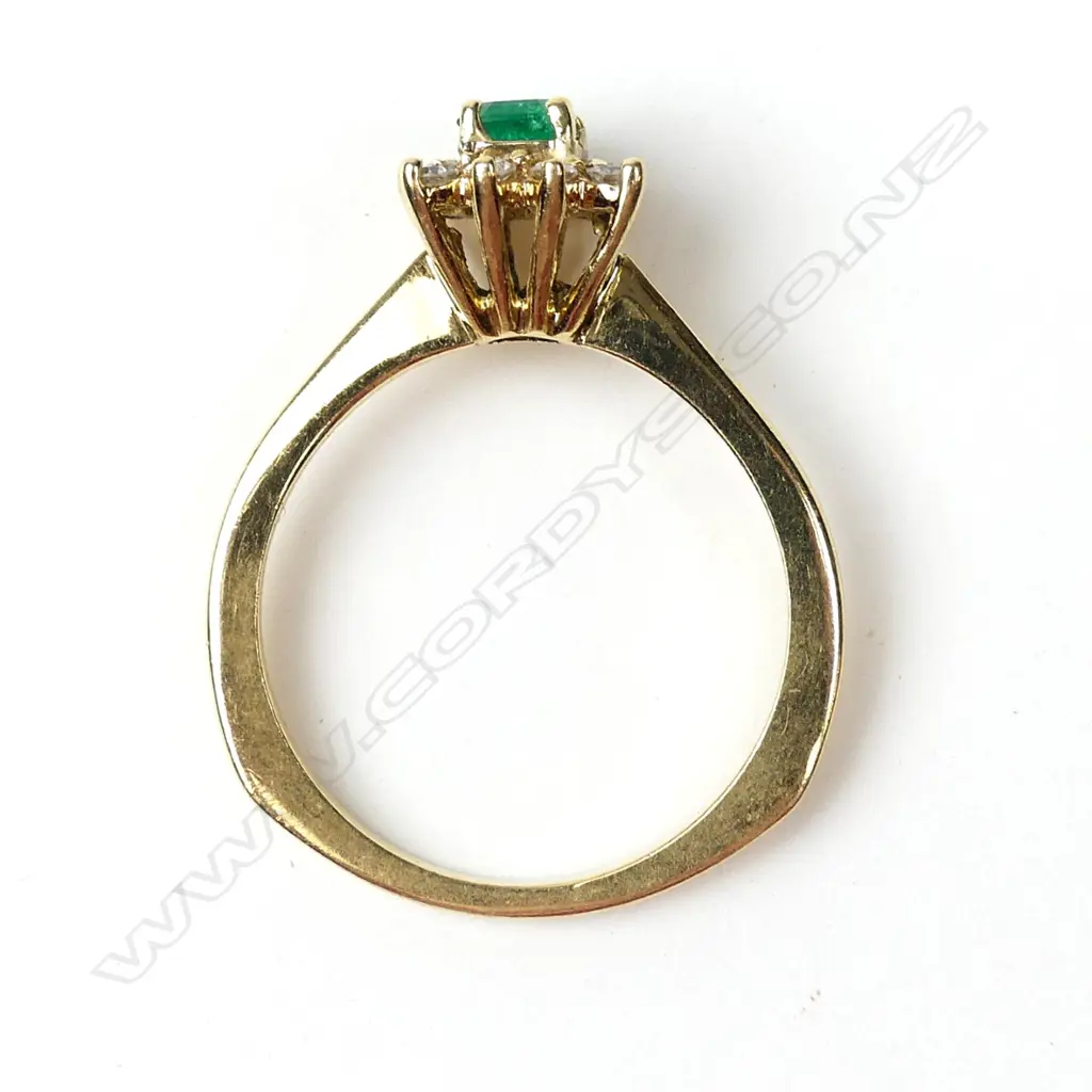 An 18ct gold emerald and diamond ring Image 1++