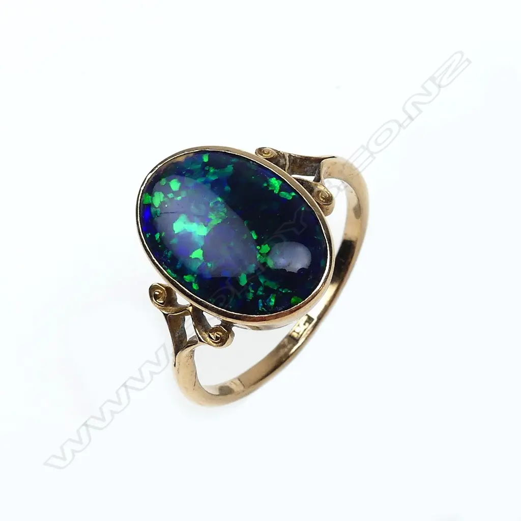 A 15ct rose gold and black opal ring Image 1++