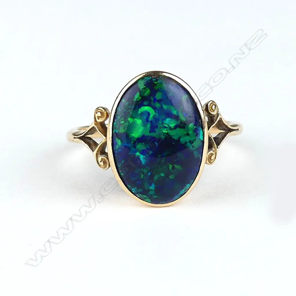 A 15ct rose gold and black opal ring Image 1++