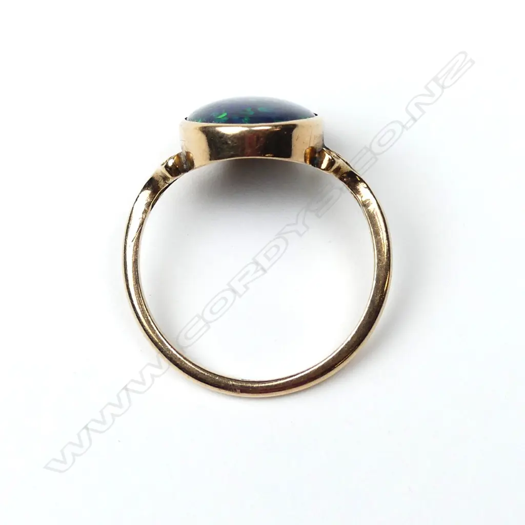 A 15ct rose gold and black opal ring Image 1++