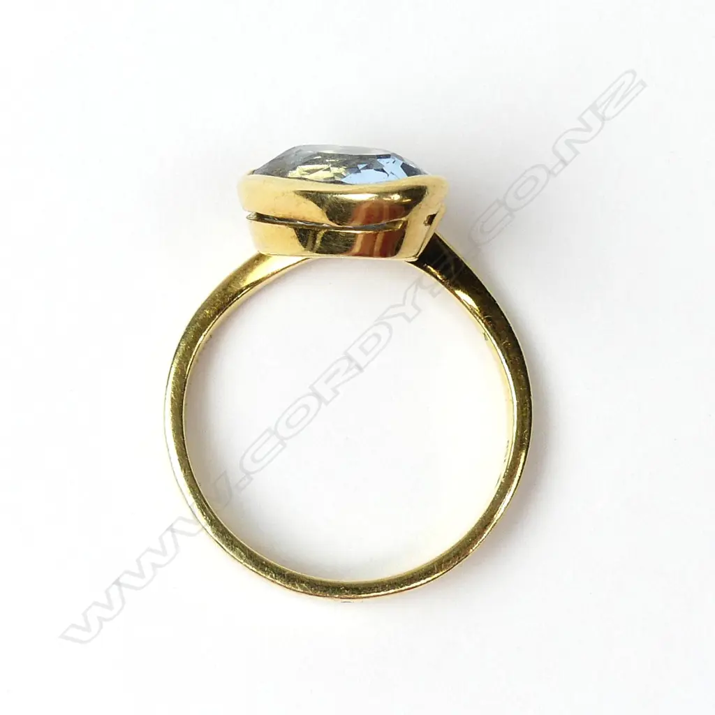 An 18ct gold aquamarine and diamond ring Image 1++