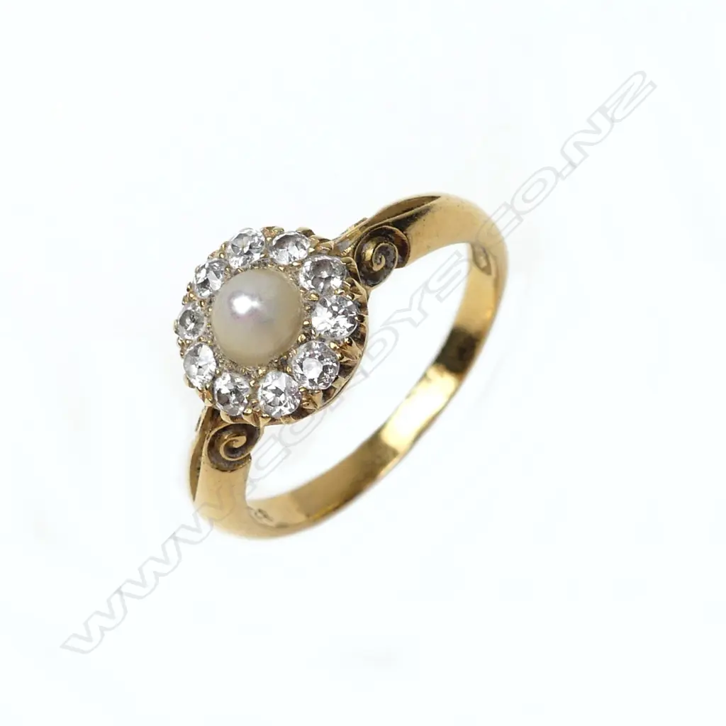 An 18ct gold pearl and diamond ring Image 1++