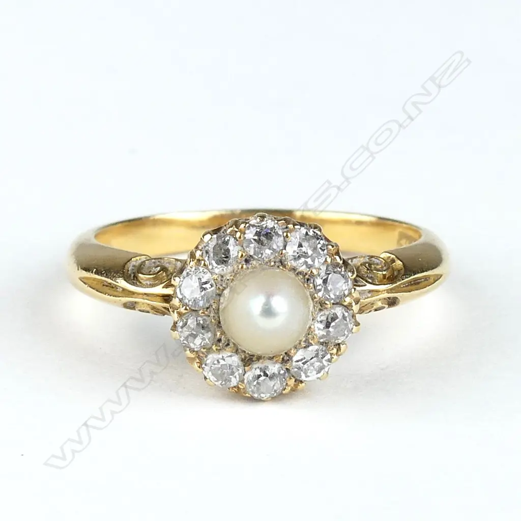 An 18ct gold pearl and diamond ring Image 1++