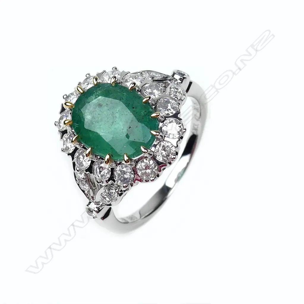 A 14ct gold emerald and diamond ring Image 1++